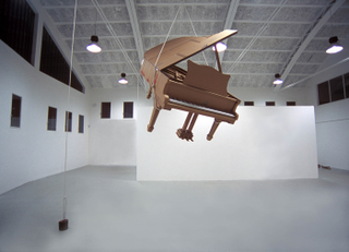 Illustration for article titled Full-Size Cardboard Aston Martin for Papier-Mâché Bonds